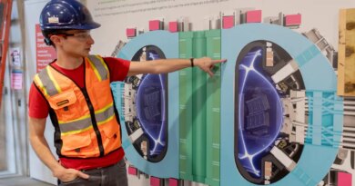Alex Creely, director of Tokamak operations at Commonwealth Fusion Systems, points to a reactor schematic.