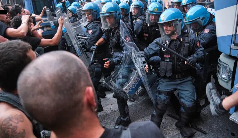Police clash with protesters in Bologna after a rally over the death of Abderrahim Fakir turned violent.