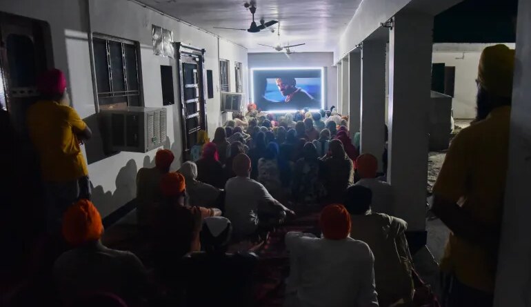 Villagers watch a special screening of Satluj at a Sikh temple at Tatley village, in Punjab’s Gurdaspur district, India, July 8, 2026