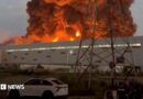 Smoke rises from a Wildberries warehouse on fire after an attack in Nevinnomyssk, Russia, July 22, 2026