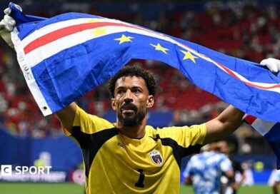 Vozinha holding Cape Verde flag