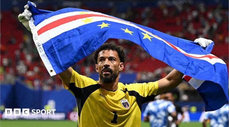 Vozinha holding Cape Verde flag