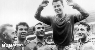 Just Fontaine being held up by his France team-mates at the 1958 World Cup