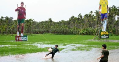 Children play football in front of cutouts of Portugal’s Cristiano Ronaldo and Brazil’s Neymar Jr put up by supporters ahead of the 2026 FIFA World Cup, in Kozhikode, India, on June 9, 2026