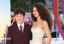 Tom Holland waving for cameras