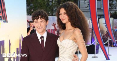 Tom Holland waving for cameras
