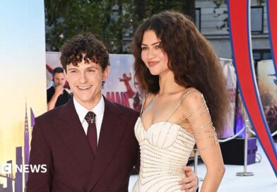 Tom Holland waving for cameras