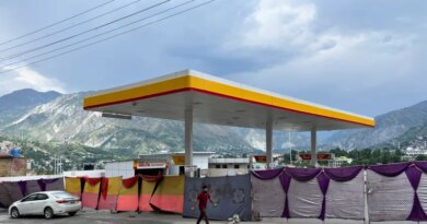A man walks past a closed fuel station with the entrance blocked off by a cloth in the background, during a shutdown strike called by the recently banned Joint Awami Action Committee (JAAC), an alliance of civil society groups, in Muzaffarabad, Pakistani Kashmir, June 19, 2026. Picture taken with a mobile phone. REUTERS/Naseer ud Din