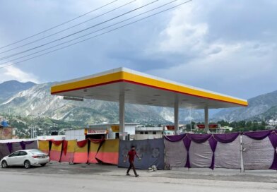A man walks past a closed fuel station with the entrance blocked off by a cloth in the background, during a shutdown strike called by the recently banned Joint Awami Action Committee (JAAC), an alliance of civil society groups, in Muzaffarabad, Pakistani Kashmir, June 19, 2026. Picture taken with a mobile phone. REUTERS/Naseer ud Din
