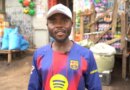 Health worker Paluku Audrey stands at a market in Bunia, Ituri Province. The 29-year-old must enter communities to explain to distrusting residents about the risks of Ebola infection