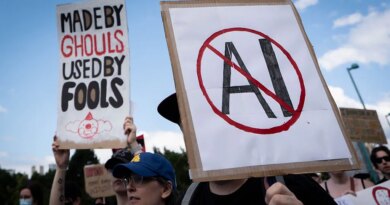 A sign opposed to AI is held during a protest against AI data centers in Vancouver, British Columbia, Canada, on Saturday, June 27, 2026. Canadians aren't universally sold on building sovereign compute, with early signs of protest against AI server farms in British Columbia and Manitoba. Photographer: Ethan Cairns/Bloomberg via Getty Images