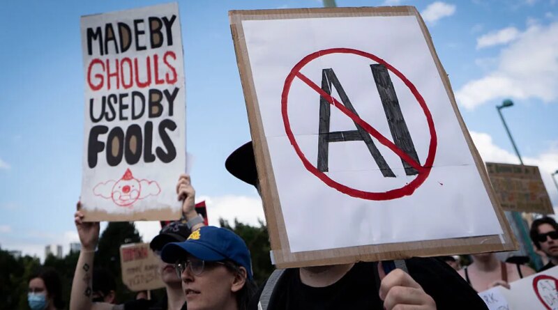 A sign opposed to AI is held during a protest against AI data centers in Vancouver, British Columbia, Canada, on Saturday, June 27, 2026. Canadians aren't universally sold on building sovereign compute, with early signs of protest against AI server farms in British Columbia and Manitoba. Photographer: Ethan Cairns/Bloomberg via Getty Images