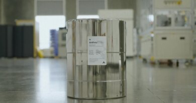 A can of electrolyte sits on a factory floor.