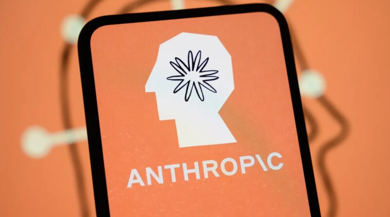 The Anthropic logo is displayed on the screen of a smartphone with the company's branding in the background.