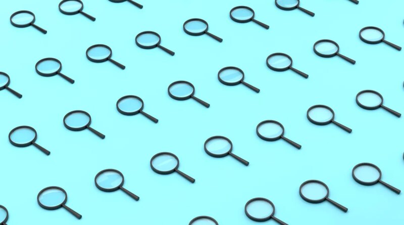 Repeated Magnifying Glass On Blue Background