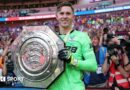 Crystal Palace keeper Dean Henderson holds up the Community Shield after his side's penalty shootout win over Liverpool