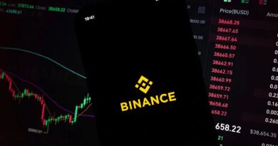 In this photo illustration, an iPhone displays the app and logo of popular cryptocurrency exchange platform Binance, with the desktop version in the background displaying market trends and exchange rates for cryptocurrency Bitcoin on 8th March, 2022 in Leeds, United Kingdom. (photo by Daniel Harvey Gonzalez/In Pictures via Getty Images)