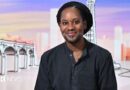 Jason Arday wears a black shirt and smiles at the camera as he appears as a guest on the panel of BBC show Sunday with Laura Kuenssberg