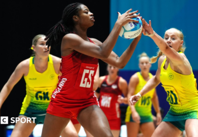 England's Liv Tchine tries to shield the ball from Australia in their bronze-medal match at the Commonwealth Games