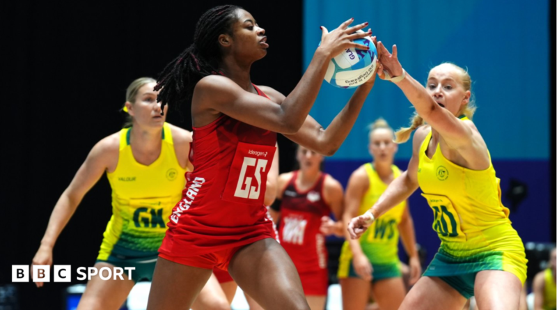 England's Liv Tchine tries to shield the ball from Australia in their bronze-medal match at the Commonwealth Games