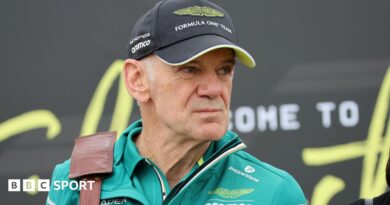 Adrian Newey inspects the Aston Martin in the team garage at the 2026 Hungarian Grand Prix