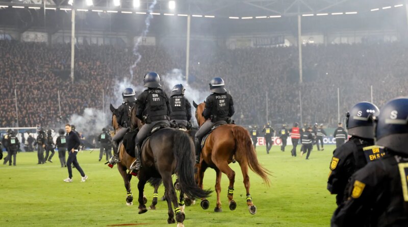 Fans and police injured in pitch invasion during ‘high risk’ German Cup tie