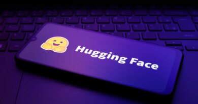 The Hugging Face logo appears on the screen of a smartphone.