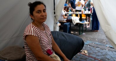 Hundreds camp on sweltering Rome street amid tussle over squatted building