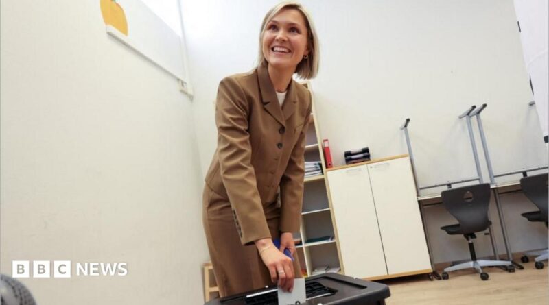 Iceland's Prime Minister Kristrun Frostadottir votes in the national referendum on resuming EU membership talks, at a polling station in Reykjavik