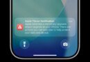 an Apple threat notification on an iPhone lock screen.