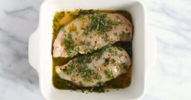 chicken marinating in dish.