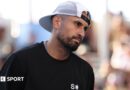 Nick Kyrgios watches on during January's Australian Open