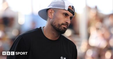 Nick Kyrgios watches on during January's Australian Open