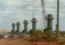 Five smoke stacks stand at a construction site in Texas.