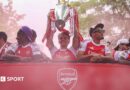 Arsenal players celebrate the Premier League title win