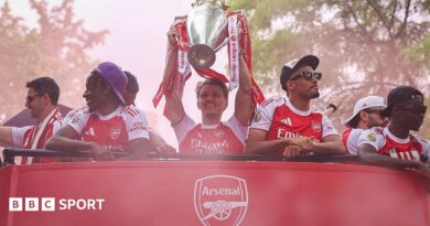 Arsenal players celebrate the Premier League title win
