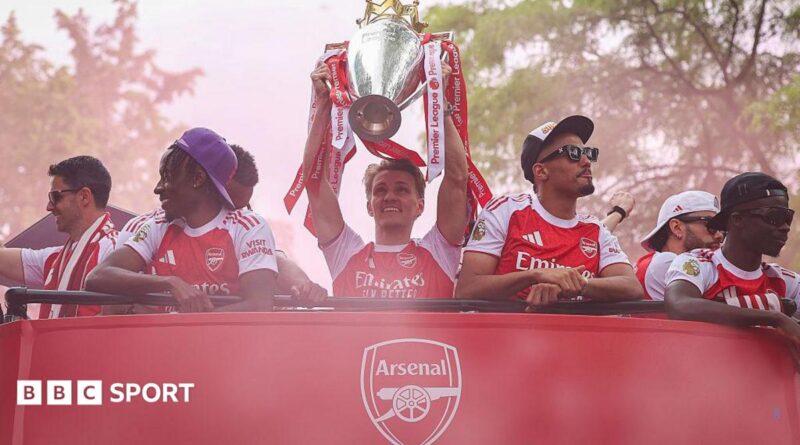 Arsenal players celebrate the Premier League title win