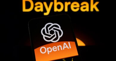 The OpenAI logo is displayed on a smartphone screen held in one hand, with the Daybreak visual in the background.