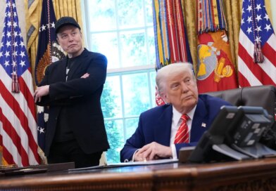 Tesla CEO Elon Musk and U.S. President Donald Trump listen to a question from reporters in the Oval Office of the White House.