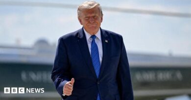 U.S. President Donald Trump gives thumbs-up as he walks from Marine One to board Air Force One.