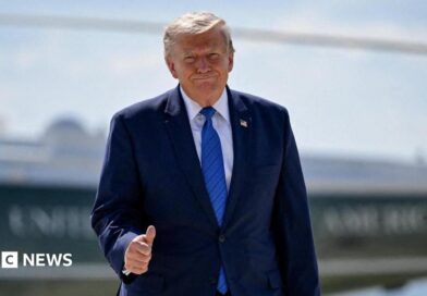 U.S. President Donald Trump gives thumbs-up as he walks from Marine One to board Air Force One.