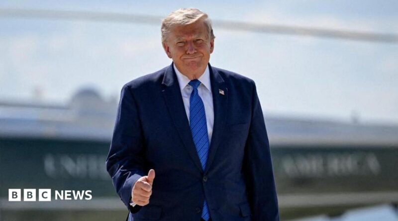 U.S. President Donald Trump gives thumbs-up as he walks from Marine One to board Air Force One.