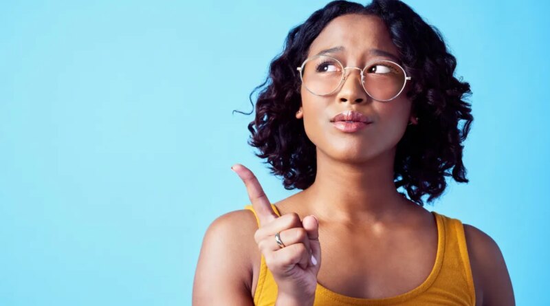 Confused woman, thinking bubble and studio mockup background. Pensive, annoyed or curious person contemplating decision. Girl with solution or idea pointing for marketing advertisement.
