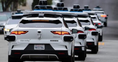 A line of Waymo robotaxis drives through North Beach on July 07, 2026 in San Francisco, California.