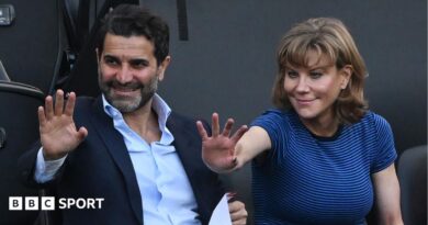 Former Newcastle United shareholders Mehrdad Ghodoussi (L) and Amanda Staveley wave from the directors' box