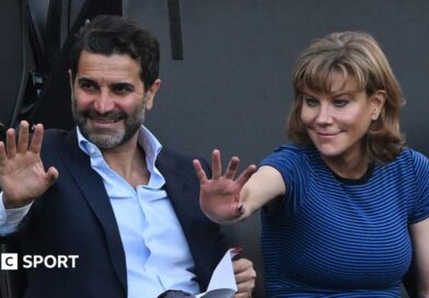 Former Newcastle United shareholders Mehrdad Ghodoussi (L) and Amanda Staveley wave from the directors' box