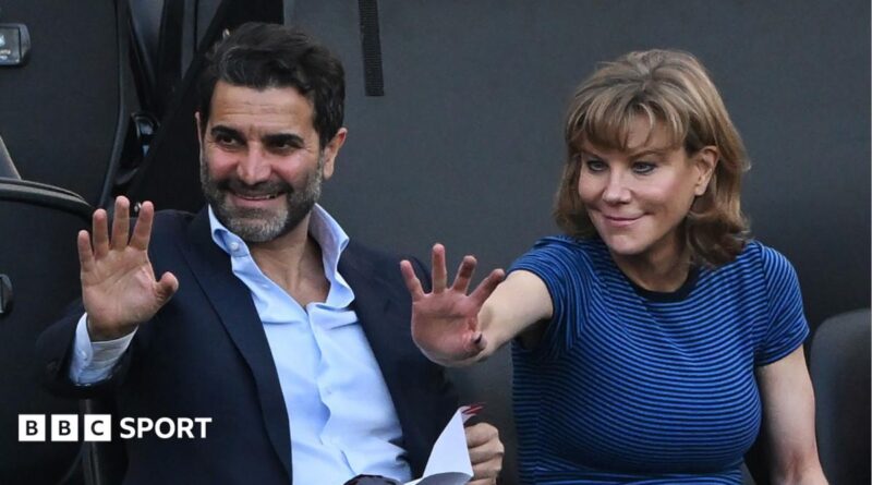 Former Newcastle United shareholders Mehrdad Ghodoussi (L) and Amanda Staveley wave from the directors' box