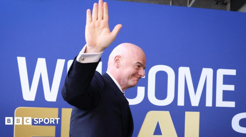 Fifa president Gianni Infantino waves while walking