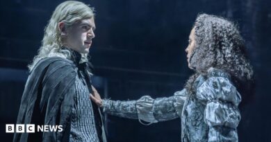 Noah Ritter (Prince Rhaegar Targaryen) and Harmony Rose-Bremner (Lyanna Stark) facing each other in costume in a scene from Game of Thrones: The Mad King. She has an arm outstretched with her palm on his chest