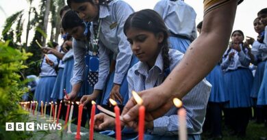 Mourners and students light candles to offer their condolences after the death of mountaineer Nirmal Purja 